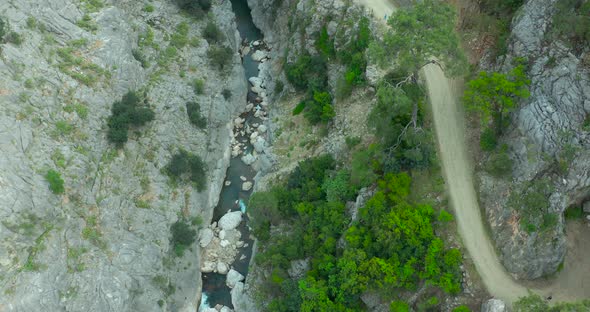 Aerial Footage Showing a Slow Flight Through a Canyon with a Blue River in Goynuk CanyonTurkey alt