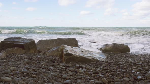 Large Stones on the Shore and a Storm Sound