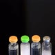 Four Vials of Insulin on a Black Background - VideoHive Item for Sale