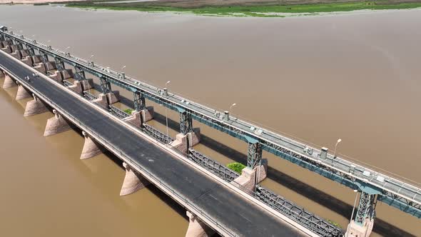 Aerial drone shot of bride above indus river in pakistan. alt