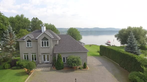 aerial real estate warterfront property rise and tilt 4k alt