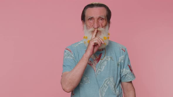 Senior Man Presses Index Finger to Lips Makes Silence Gesture Sign Do Not Tells Secret Shh Be Quiet alt