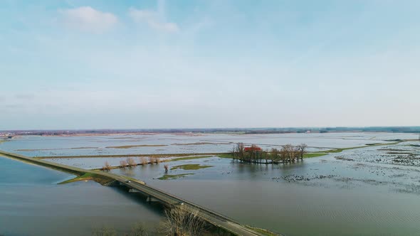 Fields and rivers, water stretching across designated flood areas