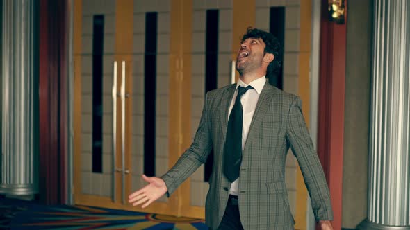 Man Wearing Suit is Dancing Like a Robot alt