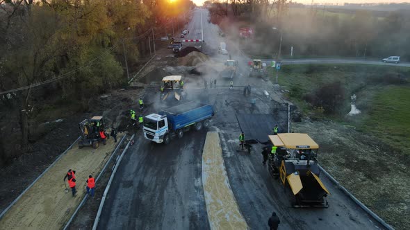 Rivne, Ukraine November 6, 2021. Construction Of The Highway, Laying Of Asphalt alt