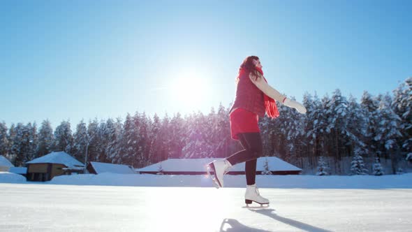 Happy Young Woman with Skates Ready To Skate on Ice Rink alt