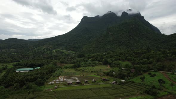 Aerial view of the village in valley, Chiang Dao mountain, Thailand by drone