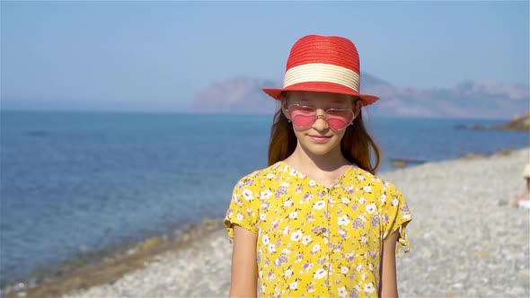 Cute Little Girl at Beach During Summer Vacation