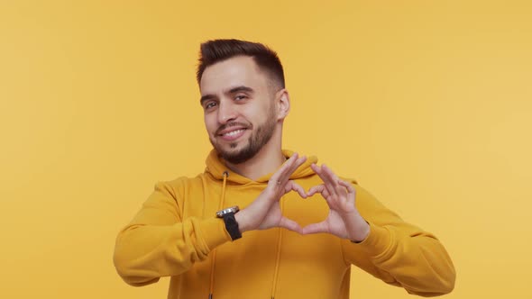 Expressive young man screaming and shouting over vibrant background. alt