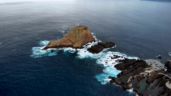 Drone Flying Over Ilheu Mole Cliff near Porto Moniz, Madeira Island, Portugal
