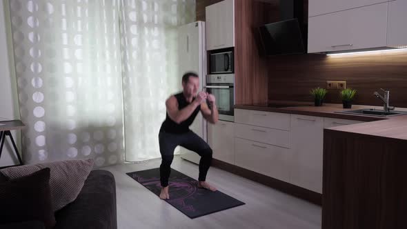 Caucasian Man Trains Abdominal Muscles at Home During Quarantine at Home