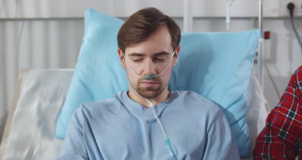 Friends Come to Visit the Sick Male Patient in Hospital alt
