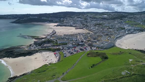 Cinematic shot aerial overlooking Porthminster Beach St Ives Cornwall England UK alt