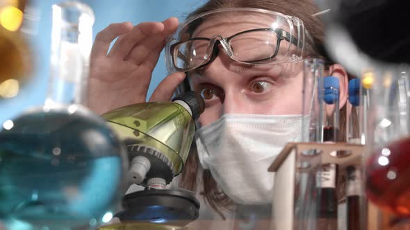 Scientist Looks Through Microscope and Rejoices at the Discovery