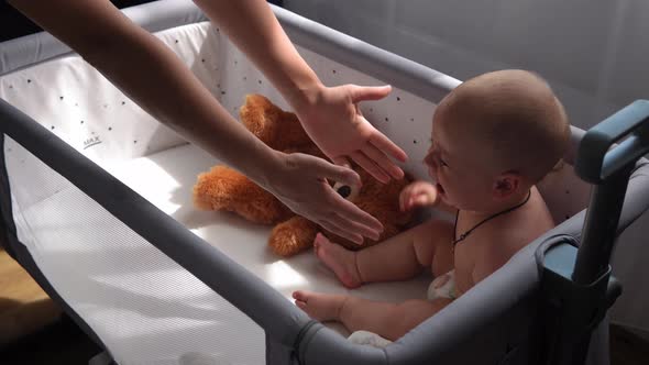 Closeup Cute Kid 10 Month Newborn Boy Crying in White Crib in Morning
