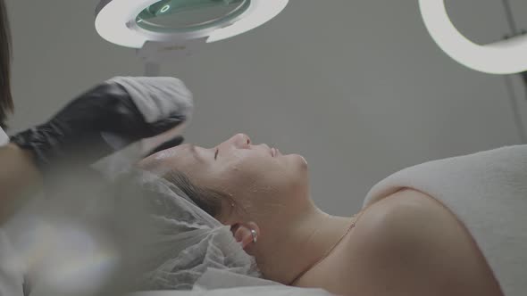 A Professional Cosmetologist Receives a Patient in His Office alt