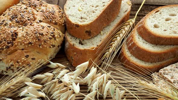 Assortment of baked goods on old wooden table. Freshly of bakery products. alt
