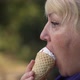 Woman Eating Icecream at the Street - VideoHive Item for Sale