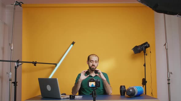 Photography Vloger Holding Round Nd Filters alt