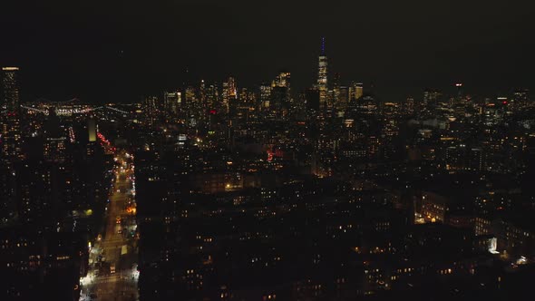 Aerial Descending Footage of Metropolis at Night alt
