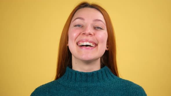Young Red Hair Woman Posing Isolated on Yellow Color Background Studio