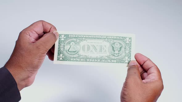 Us One Dollar Bill In Indian Hands