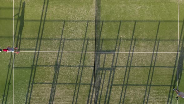View From the Height of the Tennis Court Where People Warm Up Before the Game alt