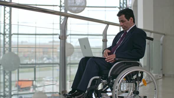 Business Person In Wheelchair alt