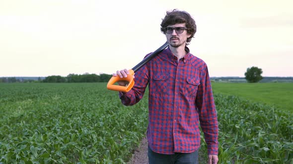 The Agronomist Goes Through the Corn Field with a Shovel alt