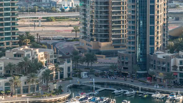 Luxury Dubai Marina Canal with Passing Boats and Promenade Timelapse Dubai United Arab Emirates alt