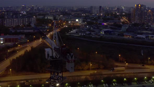 An Aerial View of the Construction Crane and the Construction of the Building at Dusk.
