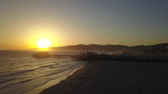 Slow motion during sunset helicopter flies in sun.Great aerial view flight drone footage at LA Sant alt