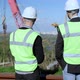 Back View Portrait of Two Positive Young Men in Uniform Talking Looking at Industrial Park and - VideoHive Item for Sale