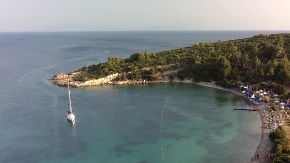 View From Above Aerial View of a Boat Sailing on a Transparent and Turquoise Sea alt