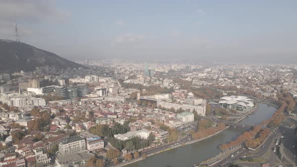 Tbilisi, Georgia - October 25 2021: Flying over Baratashvili bridge in the center of Tbilisi alt
