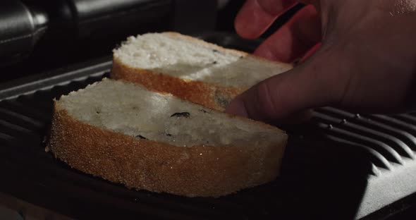 Put Slices Of Fresh Bread On The Heated Grill Surface