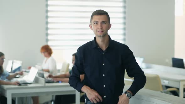 Confident Happy Office Worker Looking at Camera in Modern Office, Positive Male Employee  alt