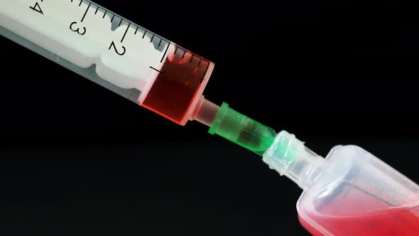 Plastic medical syringe with needle and plastic vial. Medical injection concept.