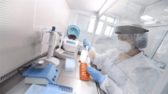 Female Scientist Makes PCR DNA Tests in a Modern Chemical and Bacteriological Laboratory alt