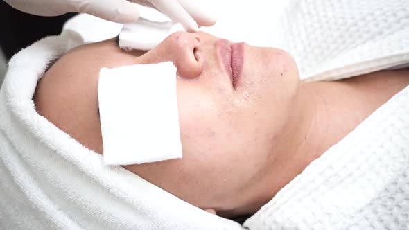 Young Asian Woman Getting Skincare Treatment By Beautician at Cosmetology Beauty Clinic alt