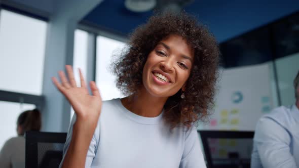 Businesswoman Talking with Coworker in Online Chat. Professional Waving Hand alt
