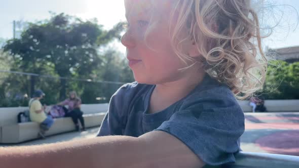 Small Girl Spinning on Roundabout alt