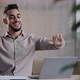 Smiling Happy Arab Man Worker Businessman Finished Task Computer Work Relax Sit at Workplace Desk