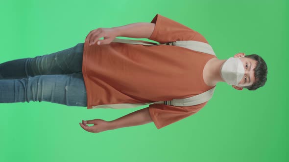 The Front View Of Asian Boy Student Walking  To School On Green Screen Chroma Key alt