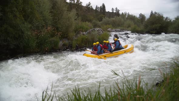 Super slow motion shot of group of people white water rafting, shot on Phantom Flex 4K