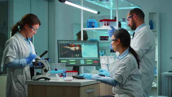 Team Doctors Studying DNA Mutation alt