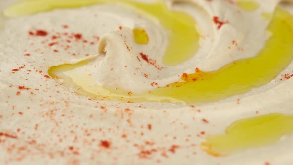 Hummus with smoked paprika and olive oil close up. Healthy vegan food alt