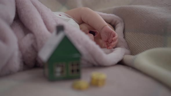 Portrait of Yawning Newborn Infant Girl Stretching Hands in Slow Motion Lying in Bed Falling Asleep alt