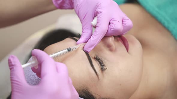 Receiving mesotherapy procedure, cosmetology. Skincare concept. alt