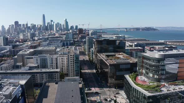 Aerial shot flying over Mission Bay and 3rd Street towards downtown San Francisco. 4K alt